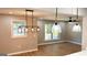 Open-concept living area with new floors, modern lighting, and natural light at 5324 Joan Of Arc, Atlanta, GA 30349