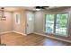 Inviting living room with new floors, ceiling fan, and ample natural light at 5324 Joan Of Arc, Atlanta, GA 30349