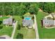 Aerial view of a beautiful home with an in-ground pool and landscaped backyard at 230 Hummingbird Ct, Hampton, GA 30228