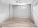 Unfurnished basement with neutral carpeting, a ceiling fan, and window, ready for customization at 230 Hummingbird Ct, Hampton, GA 30228