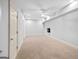 Spacious finished basement features a ceiling fan and ample room for activities at 230 Hummingbird Ct, Hampton, GA 30228