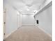 Spacious basement offers neutral tones and ample space for versatile use and customization at 230 Hummingbird Ct, Hampton, GA 30228