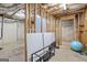 Unfinished basement framing and utilities expose the structure, offering a glimpse of the home's bones at 230 Hummingbird Ct, Hampton, GA 30228