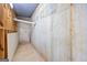Basement utility corner exhibiting concrete foundation, piping, and a clean, minimalist aesthetic at 230 Hummingbird Ct, Hampton, GA 30228