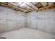 Exposed concrete unfinished basement showing the foundation and electrical system at 230 Hummingbird Ct, Hampton, GA 30228