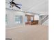 Finished basement featuring a bar area with stone accents, open layout, and staircase at 230 Hummingbird Ct, Hampton, GA 30228