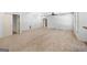 Expansive finished basement with neutral carpet and paint ready for customization at 230 Hummingbird Ct, Hampton, GA 30228
