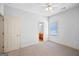 Bedroom with neutral carpet and a view to the en suite bathroom at 230 Hummingbird Ct, Hampton, GA 30228