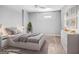 Staged bedroom with neutral walls and carpet features contemporary decor and soft lighting at 230 Hummingbird Ct, Hampton, GA 30228