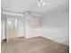 Bedroom with neutral carpet and paint and open doorway showing other rooms at 230 Hummingbird Ct, Hampton, GA 30228