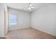 Empty bedroom with neutral walls, carpet, and a ceiling fan at 230 Hummingbird Ct, Hampton, GA 30228