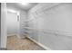 Walk-in closet with neutral colored carpet and wire shelving at 230 Hummingbird Ct, Hampton, GA 30228