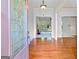 Spacious foyer with hardwood flooring and decorative glass front door at 230 Hummingbird Ct, Hampton, GA 30228