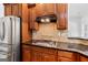 Close-up of kitchen with stainless steel appliances and a tile backsplash at 230 Hummingbird Ct, Hampton, GA 30228