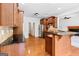 Open kitchen with stainless steel appliances, wooden cabinets, and granite countertops at 230 Hummingbird Ct, Hampton, GA 30228