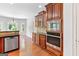 Kitchen with wooden cabinets, stainless steel appliances, and access to the breakfast area at 230 Hummingbird Ct, Hampton, GA 30228
