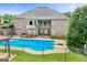 An in-ground pool with diving board, deck, and gazebo, surrounded by a fenced yard at 230 Hummingbird Ct, Hampton, GA 30228