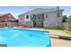 Backyard pool with lush landscaping, a patio, and a view of the home's exterior at 230 Hummingbird Ct, Hampton, GA 30228