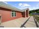 Expansive deck with cable railings provides outdoor space and views of backyard, solar panels, and additional garage at 4335 Hurt Bridge Lane, Cumming, GA 30028