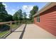 Spacious deck with cable railings offers scenic views of the lake and property at 4335 Hurt Bridge Lane, Cumming, GA 30028