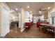 Open-concept kitchen with stainless steel appliances, granite counters, and beautiful hardwood floors at 4335 Hurt Bridge Lane, Cumming, GA 30028