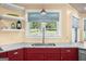 Charming kitchen with a stainless steel sink and a window view of the outdoors at 4335 Hurt Bridge Lane, Cumming, GA 30028