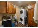 Functional laundry room with modern washer and dryer, ample cabinet space, and practical shelving at 4335 Hurt Bridge Lane, Cumming, GA 30028