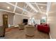 Open-plan living room with vaulted ceilings, ceiling fans, hardwood floors, and stylish furniture at 4335 Hurt Bridge Lane, Cumming, GA 30028