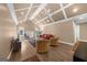 This living room features vaulted ceilings, hardwood floors, ceiling fans, and comfortable seating arrangement at 4335 Hurt Bridge Lane, Cumming, GA 30028