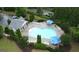 Aerial view of a community pool, pool house and lounge area at 241 Balaban Cir # 241, Woodstock, GA 30188