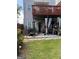 Multi-level backyard featuring a furnished patio and lush greenery at 241 Balaban Cir # 241, Woodstock, GA 30188