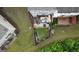 Aerial view of backyard featuring a cozy patio area with outdoor seating and lush greenery at 241 Balaban Cir # 241, Woodstock, GA 30188