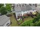 Aerial view of townhome backyards with patios, decks, and well-maintained lawns at 241 Balaban Cir # 241, Woodstock, GA 30188