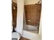 Tiled bathtub with showerhead, shower curtain and toilet at 241 Balaban Cir # 241, Woodstock, GA 30188