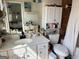 Bright bathroom with a vanity with sink and faucet, cabinet, toilet, and tiled wall at 241 Balaban Cir # 241, Woodstock, GA 30188