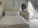 Bright bedroom featuring a neatly made bed, dresser, and natural light at 241 Balaban Cir # 241, Woodstock, GA 30188