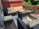 Cozy outdoor deck with comfortable seating and a fire pit for relaxing evenings at 241 Balaban Cir # 241, Woodstock, GA 30188