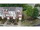 Beautiful townhomes boast brick facades, private garages, and landscaped front yards at 241 Balaban Cir # 241, Woodstock, GA 30188
