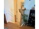 Hallway with wooden banister, wainscoting, and view of the entrance to a room at 241 Balaban Cir # 241, Woodstock, GA 30188