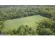 Aerial view of large land parcel bordered by lush green trees at 241 Balaban Cir # 241, Woodstock, GA 30188