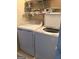 Washer and dryer in the laundry area with shelving above at 241 Balaban Cir # 241, Woodstock, GA 30188