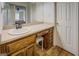 Bathroom vanity with wood cabinets, solid surface counters and view of the main bedroom at 369 Parker Rd, Mcdonough, GA 30252