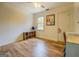 Well-lit bedroom showcasing wood-look flooring, a modern ceiling fan, and a decorative globe adding charm to the space at 369 Parker Rd, Mcdonough, GA 30252