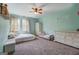 Spacious bedroom with a large bed, dresser, and ample natural light perfect for relaxation and comfort at 369 Parker Rd, Mcdonough, GA 30252