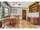 Bright dining area features wood floors, a round table, and built-in shelving with desk at 369 Parker Rd, Mcdonough, GA 30252