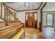 Foyer with hardwood floors, a wooden staircase, and a grand entryway at 369 Parker Rd, Mcdonough, GA 30252