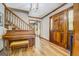 Grand foyer with hardwood floors, a wooden staircase, and a beautiful front door at 369 Parker Rd, Mcdonough, GA 30252