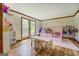 Bright playroom featuring hardwood floors, large windows, and play furniture at 369 Parker Rd, Mcdonough, GA 30252