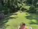 Spacious backyard featuring lush greenery, ideal for relaxation and outdoor activities at 8113 Fieldstream Way, Douglasville, GA 30134