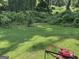 Lush backyard with mature trees and healthy green lawn at 8113 Fieldstream Way, Douglasville, GA 30134
